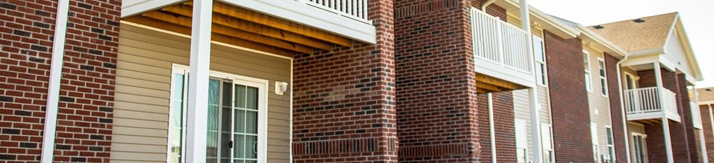 a row of windows on the side of a house